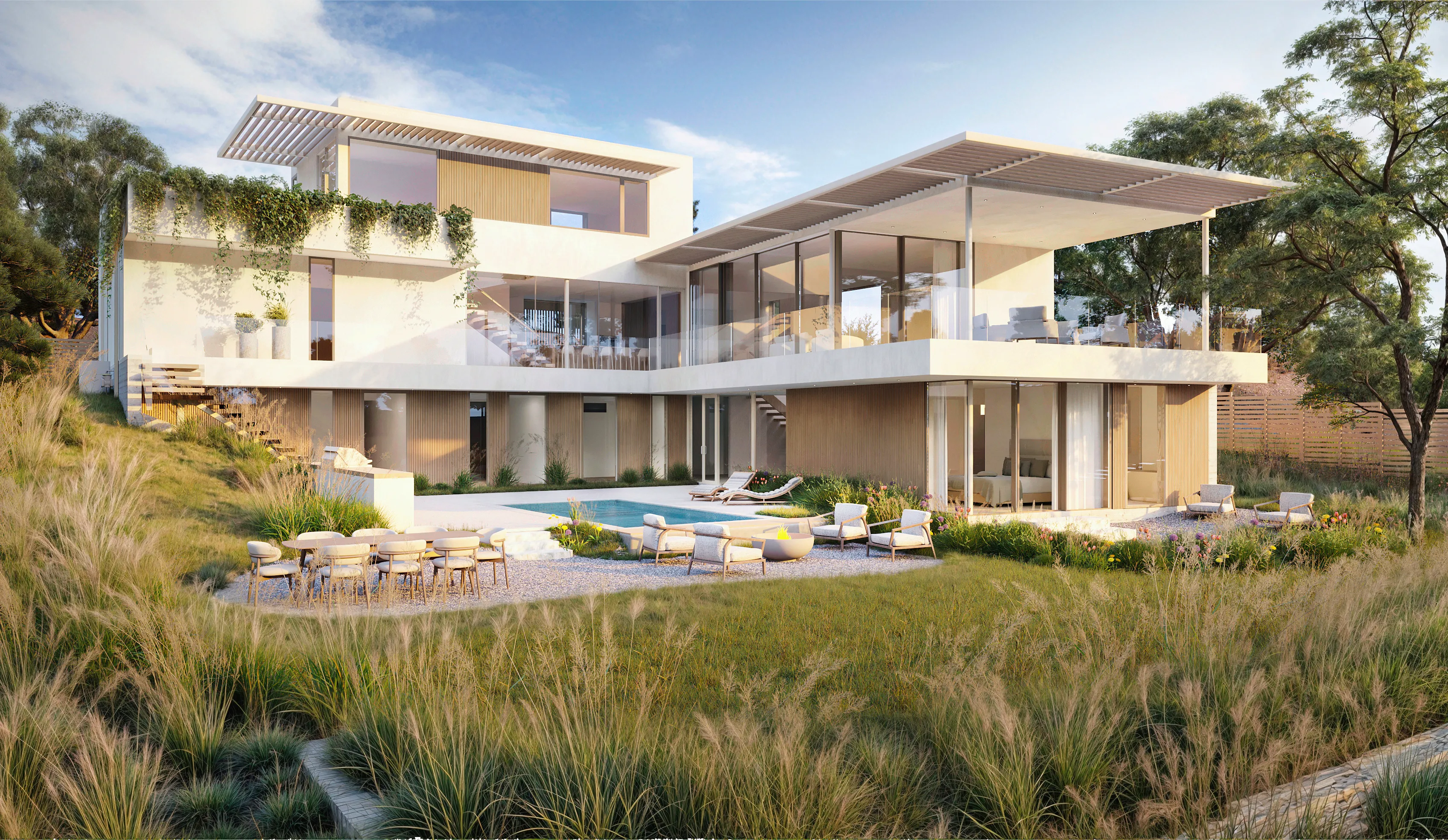 A back view of a modernist house, with large windows and a balcony.